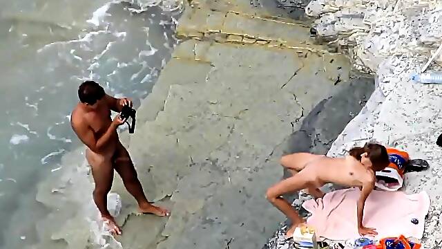 Beach voyeur captures a horny amateur couple having wild sex
