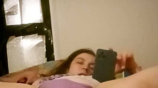 Watch this busty amateur babe orgasm while watching porn with her big tits and wet pussy