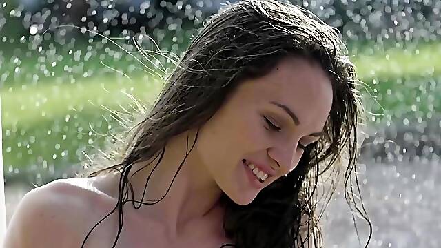 Lovely naked Ukrainian teen Rita Y dancing in the summer rain outdoor